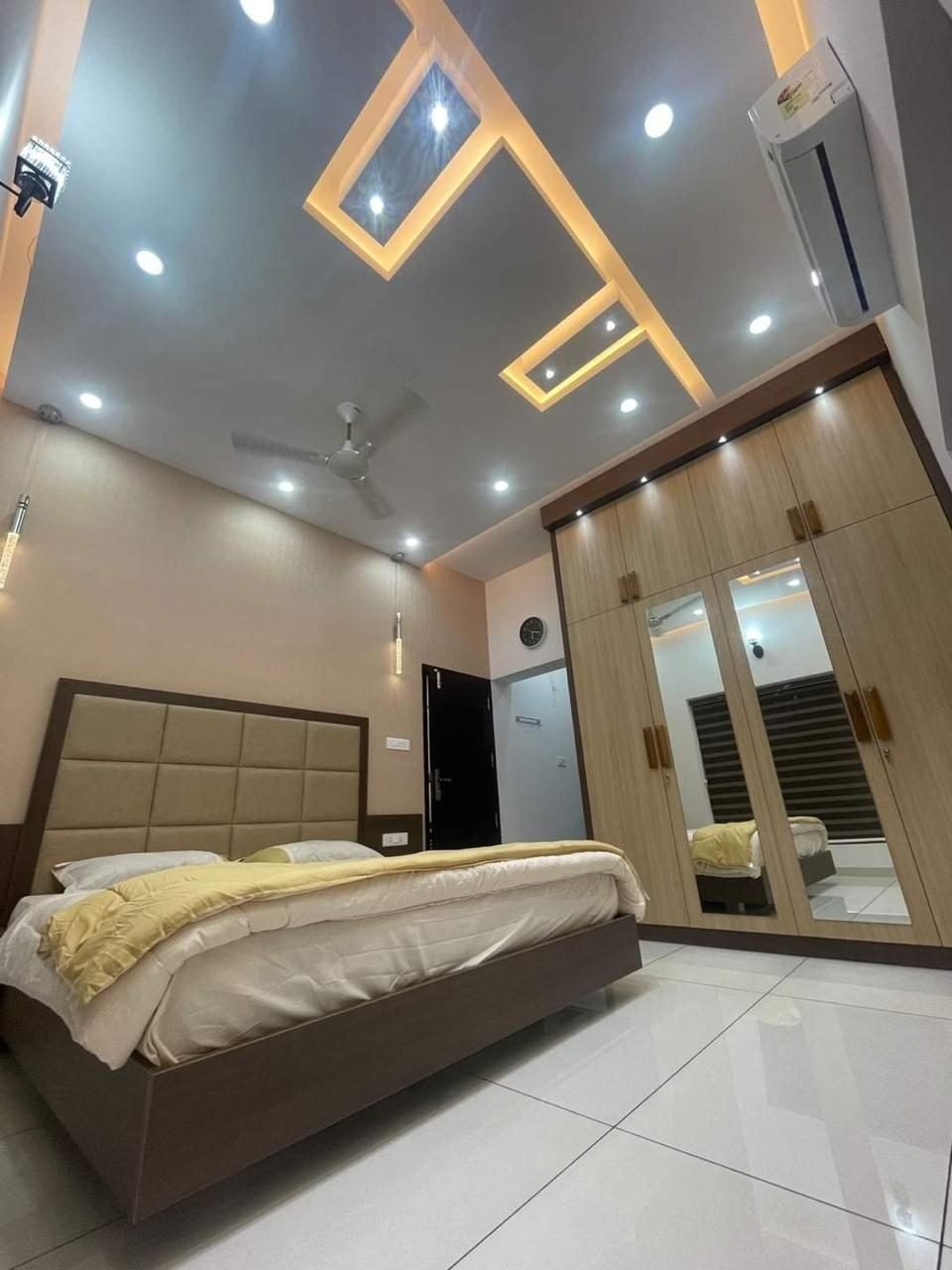 Bedroom with mirrored wardrobe and ceiling design, Vadodara